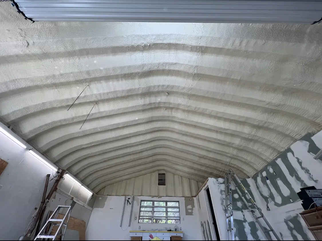 Spray polyurethane foam applied to the underside of a metal roof deck in Argyle